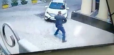 A screengrab shows a rape accused man ramming his car into a security gaurd.