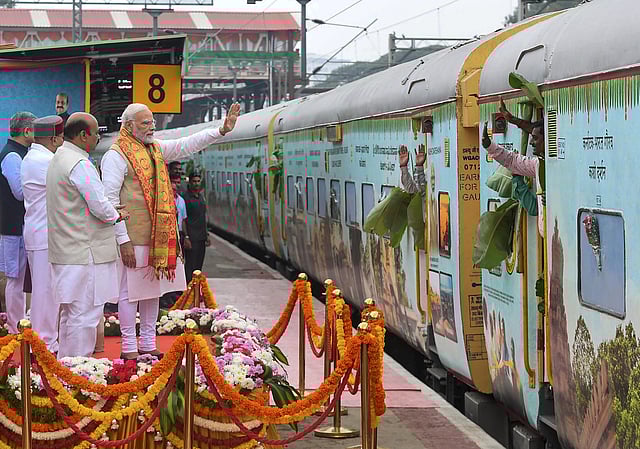Prime Minister Narendra Modi during the flag-off of the Bharat Gaurav Kashi Darshana Train, at KSR railway station in Bengaluru. Karnataka is the first state to take up this train under the Bharat Gaurav scheme in which the Government of Karnataka and the Ministry of Railways are working together to send pilgrims from Karnataka to Kashi. (Photo | PTI)