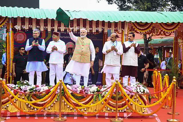 Union Ministers Ashwini Vaishnaw and Pralhad Joshi, and Karnataka Governor Thaawarchand Gehlot and CM Basavaraj Bommai are also seen here as Prime Minister Narendra Modi flags off south India's first Vande Bharat Express train, connecting Mysuru and Chennai via Bengaluru, at KSR railway station in Bengaluru, on November 11, 2022. (Photo | PTI)
