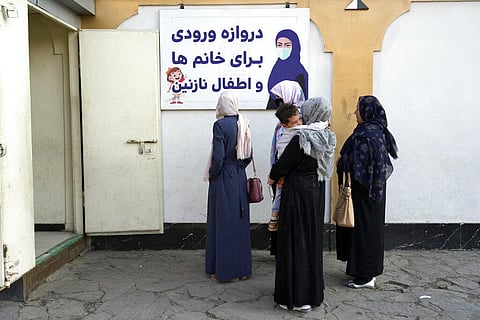 Afghan women stand outside an amusement park, in Kabul, Nov. 10, 2022. (Photo | AP)