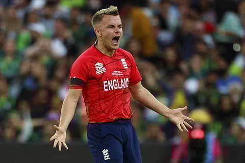England's Sam Curran celebrates the dismissal of Pakistan's Mohammad Rizwan during the final of the T20 World Cup, Nov. 13, 2022. (Photo | AP)