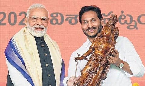 Prime Minister Narendra Modi receives a memento from Chief Minister YS Jagan Mohan Reddy at a public meeting in Visakhapatnam on Saturday | Express
