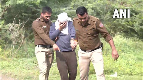 Accused Aftab Poonawala being brought to the jungle where he allegedly disposed off parts of Shraddha's body. (Photo | ANI Twitter)
