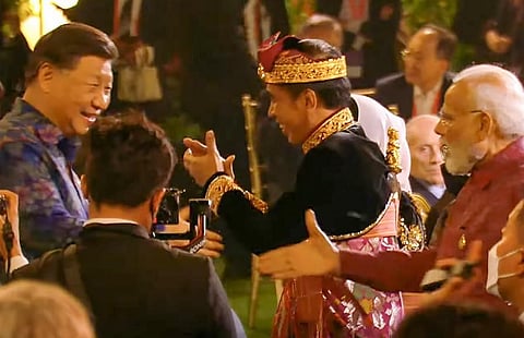 India's Prime Minister Modi with Chinese President Xi Jinping at the Welcoming Dinner during G20 Leaders' Summit, at the Garuda Wisnu Kencana Cultural Park, in Badung, Bali. (Photo | PTI)