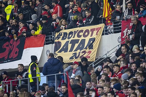 A placard with the inscription 'Boycott Qatar 2022' seen in the SC Freiburg fan block before the Bundesliga soccer match at Europa-Park Stadion, Germany, Nov. 13, 2022.  (Photo | AP)