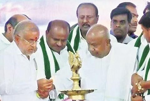 Fomer PM HD Deve Gowda lights the lamp during an event in Mulbagal | Express