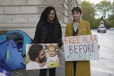 Sanaa Seif, sister of Egypt's leading pro-democracy activist Alaa Abdel-Fattah, left, poses with Caroline Lucas, Green Party MP outside the Foreign Office in London, Nov. 1, 2022. (Photo | AP)
