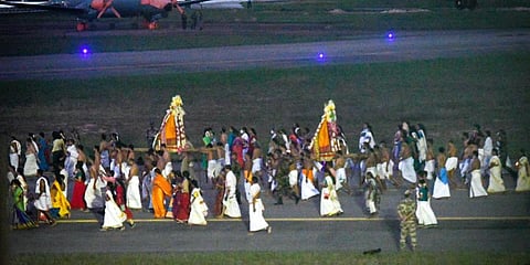 The Arattu procession, passes through the runway of the Thiruvananthapuram International Airport, Tuesday, Nov. 1, 2022.(Photo | PTI)
