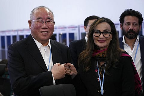 Xie Zhenhua, China's special envoy for climate, left, and Sherry Rehman, minister of climate change for Pakistan. (Photo | AP)