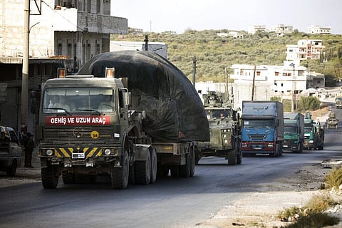 Turkish military convoy drives through the village of Urum al-Jawz, in Idlib province, Syria (Photo | AP)