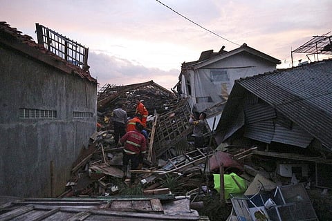 Rescuers search for survivors at the ruins of houses damaged by an earthquake in Cianjur, West Java, Indonesia (Photo | AP)
