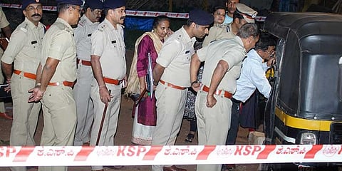 ADGP Law and Order Alok Kumar and other top police officers inspect the autorickshaw in which the blast occured, in Mangaluru on Sunday.