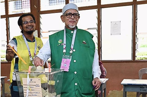 The conservative Pan-Malaysian Islamic Party (PAS), led by Abdul Hadi Awang (R), has made big gains in the latest election Handout Malaysia's Department of Information. (Photo | AFP)