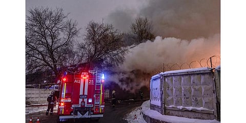 Firefighters are at work as smoke rises over the single storey warehouse after a fire broke out in Moscow, on November 20, 2022. (Photo | AFP)