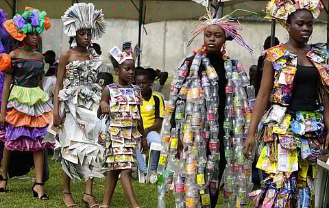 Teenage climate activists in Nigeria's largest city are recycling trash into runway outfits for a “Trashion Show.” Lagos, one of Africa’s most populous cities with more than 15 million people, generates at least 12,000 metric tons of waste daily, authorit