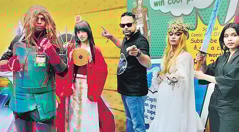 River Comics CEO Japan M Thakar with people cosplaying as characters from his production