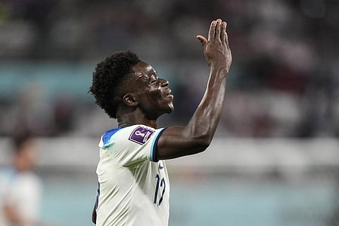SAGA! Bukayo Saka celebrates after scoring his side's fourth goal against Iran during the World Cup group B soccer match at the Khalifa International Stadium, in Doha, Nov. 21, 2022.  (Photo | AP)