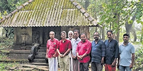 The temple revival committee members in front of Lavil Lord Siva temple in Kannur