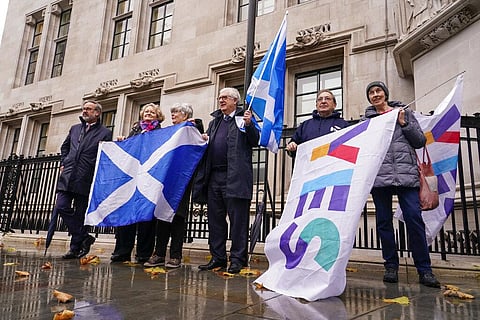 Scottish flags are held by demonstrators, outside the Supreme Court, in London, Nov. 23, 2022. (Photo | AP)