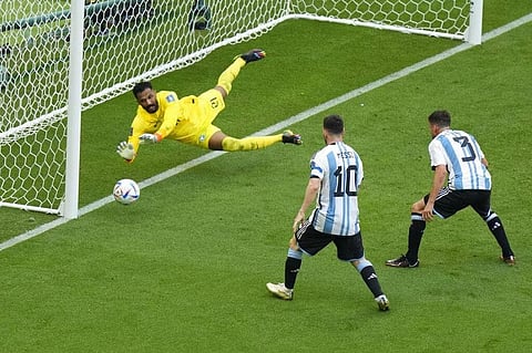 Saudi Arabia's goalkeeper Mohammed Al-Owais dives to make a save. (Photo | AP)