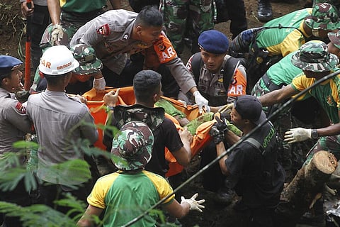 Rescuers recover the body of a victim of an earthquake-triggered landslide in Cianjur, West Java, Indonesia (Photo | AP)
