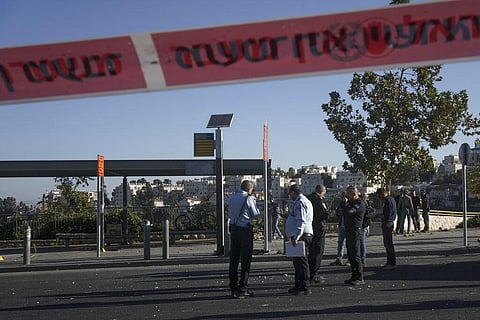 Israeli police inspect the scene of an explosion at a bus stop in Jerusalem on November 23, 2022. (Photo | AP)
