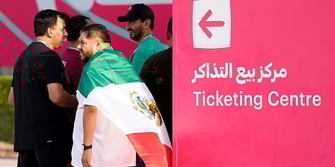 Mexico fans stand near a ticketing center for the upcoming Qatar 2022 FIFA World Cup in Doha. (Photo |AP)