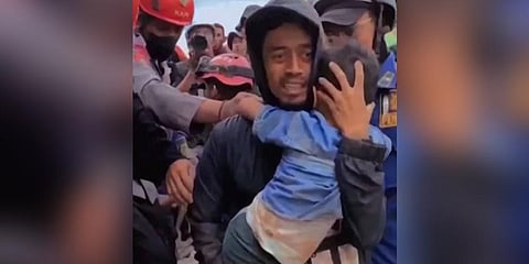 Six year old Azka was pulled from the rubble of a deadly Indonesia earthquake after spending two days trapped under debris without food or water, in a 'miracle' rescue. (Photo | AFP)