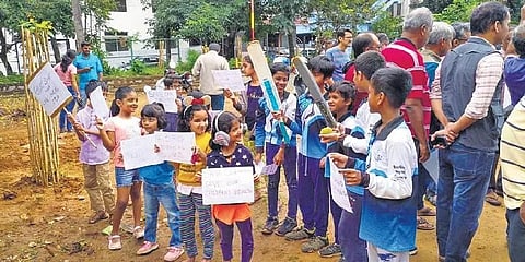 Children carrying posters take part in the protest on Wednesday | express