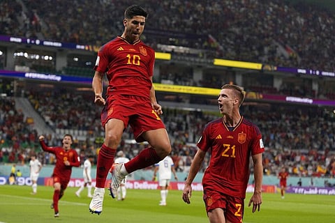 Spain's Marco Asensio, (L), celebrates with Dani Olmo after scoring his side's second goal during the World Cup group E match against Costa Rica, at the Al Thumama Stadium, Nov. 23, 2022. (Photo | AP)