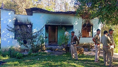 Security personnel stand guard near a forest office, a day after it was vandalised and burnt down by 'miscreants' at a disputed Assam-Meghalaya border location that killed six people. (Photo | PTI)