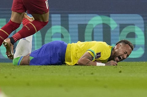 Brazil's Neymar grimaces as he falls to the ground during the World Cup group G soccer match between Brazil and Serbia, at the Lusail Stadium in Lusail, Qatar, Thursday, Nov. 24, 2022. (Photo |AP)