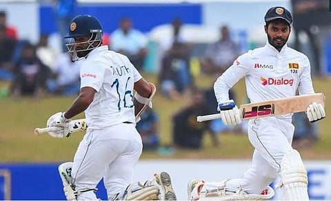 Sri Lankan players  in a Test match against Pakistan. (Photo | AFP)