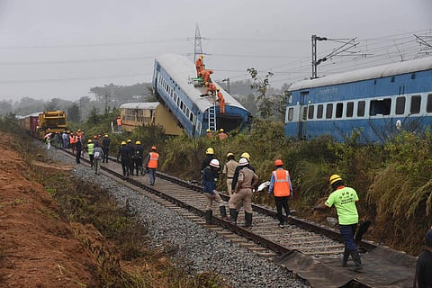 Rescue personnel on top of a derailed coach. (Photo | Vinod Kumar T)
