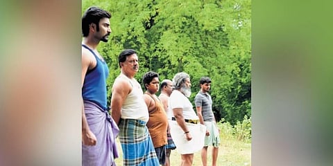 A still from the movie 'Pattathu Arasan'.