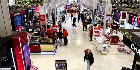 Customers shop in a nearly-empty Macy's early on Black Friday. (Photo | AP)