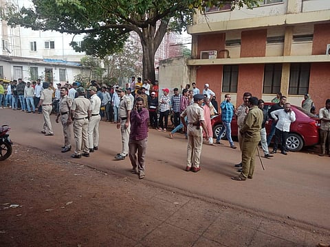 People gathered in large numbers at the premises of the civil hospital in Belagavi after the bodies of the girls were brought to the hospital. (Photo | ENS)