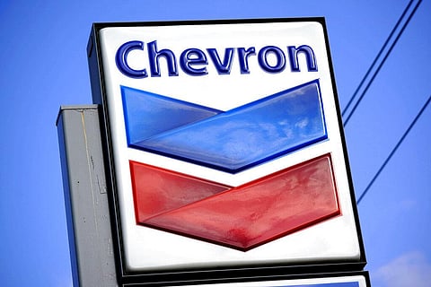 A Chevron sign is displayed outside one of the company's gas stations in Bradenton, Fla., Feb. 22, 2022. (Photo | AP)
