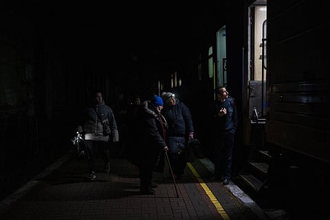 Ukrainians board the Kherson-Kyiv train at the Kherson railway station, southern Ukraine, Saturday, Nov. 26, 2022. (Photo | AP)
