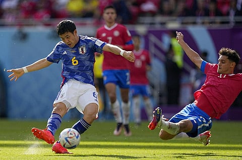 Costa Rica's Yeltsin Tejeda, right, tries to block a shot from Japan's Wataru Endo during the World Cup, group E soccer match between Japan and Costa Rica (Photo | AP)