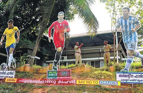Giant cutouts of football players erected in front of the Kalamassery police station in Kochi | T P Sooraj
