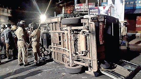 A police vehicle that was overturned by protesters at Vizhinjam. (Photo | EPS)