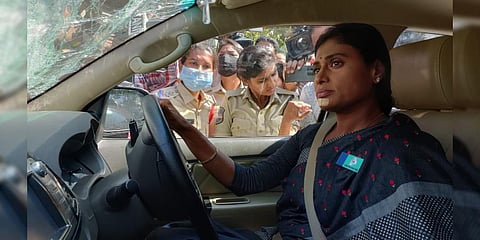 Police drag the car of YSRTP President YS Sharmila even as she sits inside it. (Photo | Express)