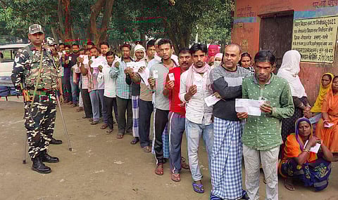 Voters stand in queue to cast their votes in the Gopalganj bye-election in Bihar on November 3, 2022. (Photo | PTI)