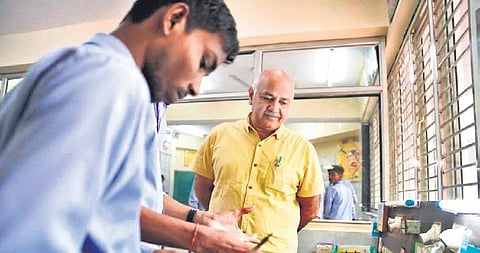 Deputy CM Manish Sisodia with students at the ITI in Khichripur on Thursday