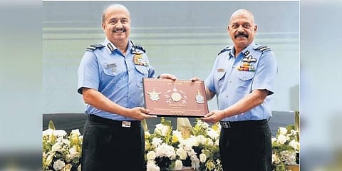 ASTE Commandant Air Vice Marshal Jeetendra Mishra (right) presents a memento to Chief of Air Staff Air Chief Marshal VR Chaudhari in Bengaluru on Friday     