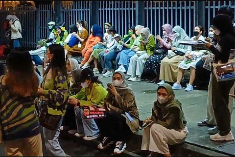 Fans of K-pop music group NCT127 gathered outside the concert venue after the event was stopped in Serpong, Banten provice, after chaos broke out and 30 people fainted in a crush. (Photo | AFP)