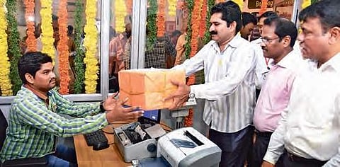 A customer booking a parcel. Image used for representational purpose | P Ravindra Babu