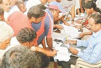 People queue up to cast their vote.