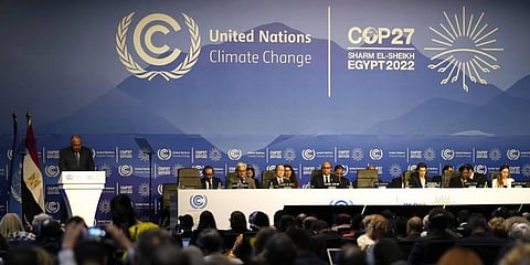 Sameh Shoukry, president of the COP27 climate summit, left, speaks during an opening session at the COP27 U.N. Climate Summit. (Photo | AP)